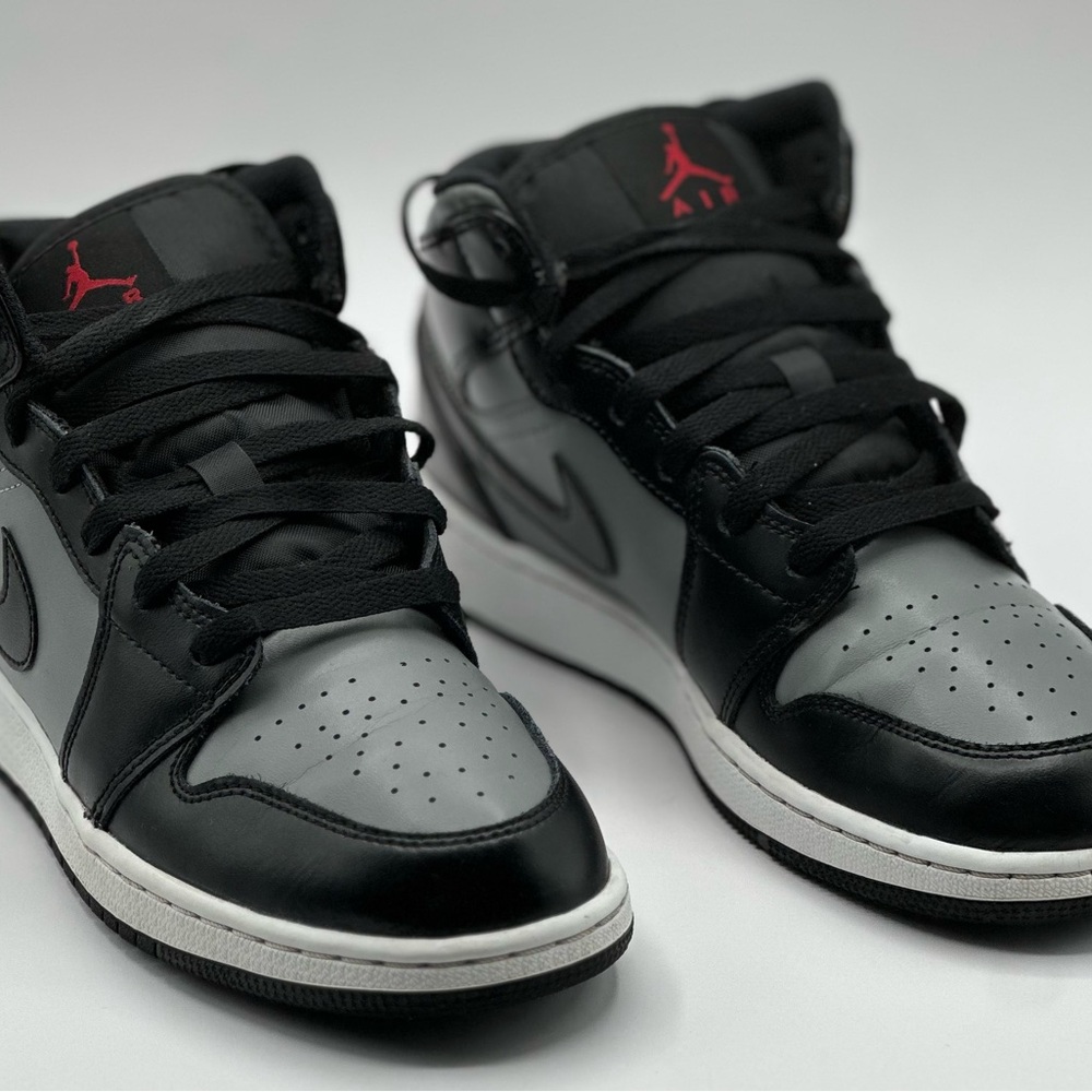 Black and Gray Sneakers with Red Accents